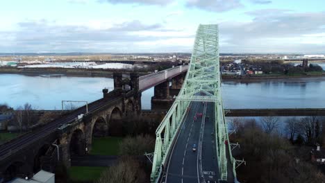 charity santa dash fun run over runcorn silver jubilee bridge aerial view high push in