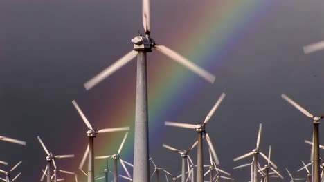 gorgeous rainbows illuminate wind powered generators spinning