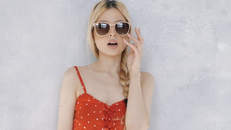 woman in red dress with sunglasses