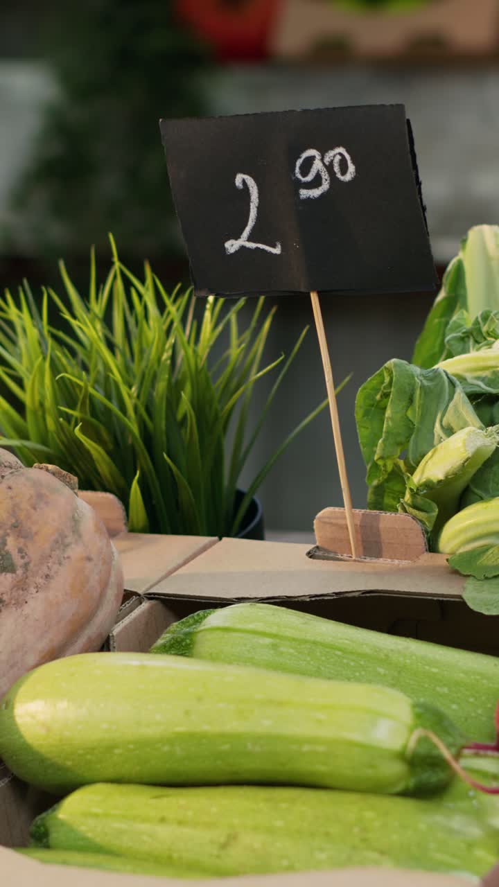 Vertical video: Natural organic fruits and vegetables on farmers market counter