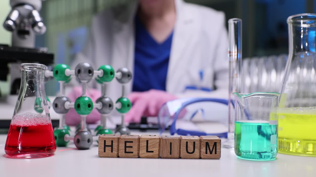 A scientist conducting an experiment in a laboratory with chemistry equipment and Helium blocks