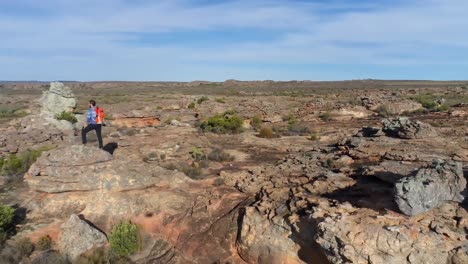 Male-rock-climber-walking-over-a-rocky-mountain-4k