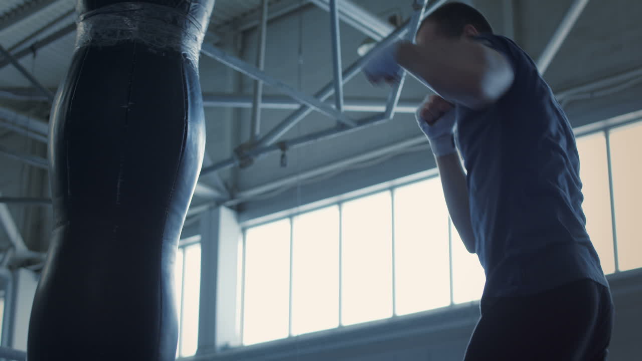 Man Practicing Boxing in Gym