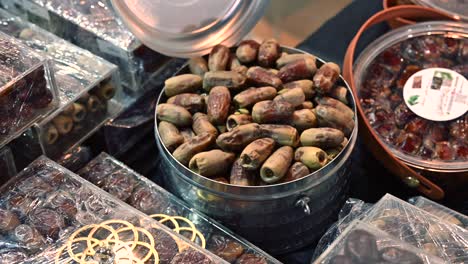 rows of emirati dates showcased in vibrant baskets at the al dhaid dates festival 2024, sharjah