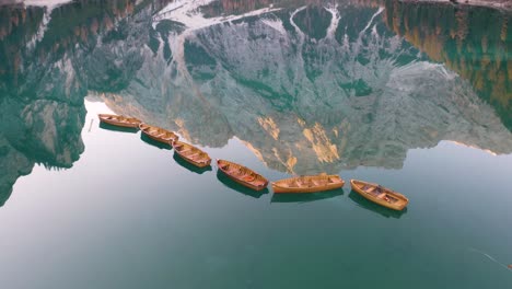dramatic aerial view row boats, lake braies, italy
