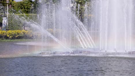 water fountain with rainbow in bangkok park