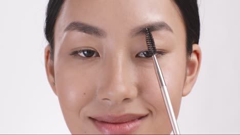 Applying eyebrow makeup