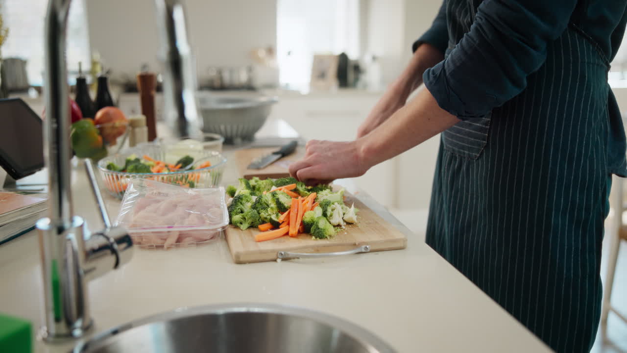 Preparing healthy meal with vegetables and chicken