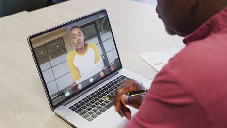 African-american-businessman-using-laptop-for-video-call-with-african-american-business-colleague