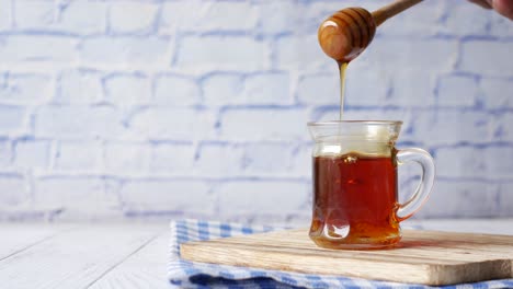 Close-up-of-fresh-honey-with-spoon-on-table