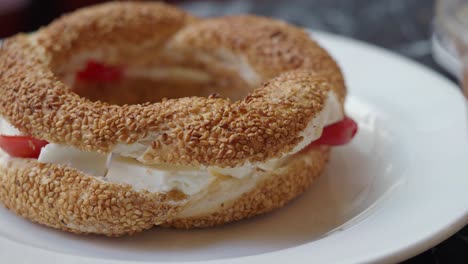 turkish bagel (simit) with cream cheese and tomato