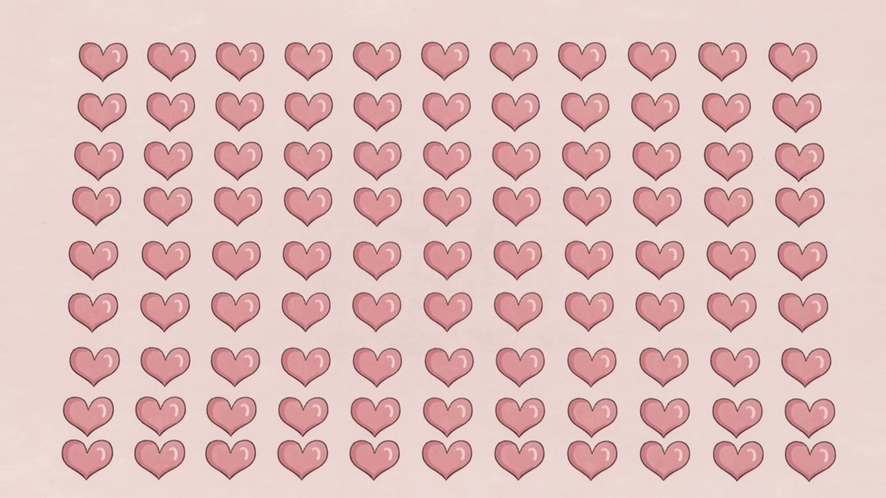 Zooming out, camera revealing centered hand-drawn pink heart block on paper, showing full grid