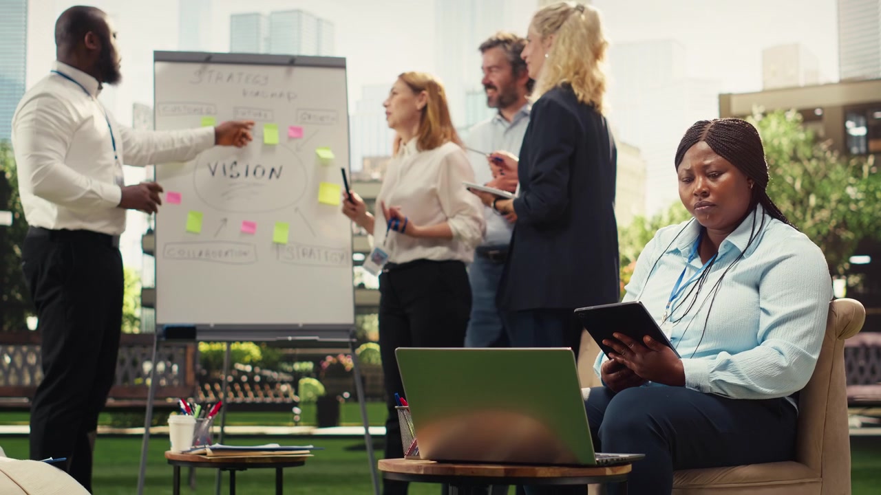 Business Team Collaborating on Strategy in Modern Outdoor Office