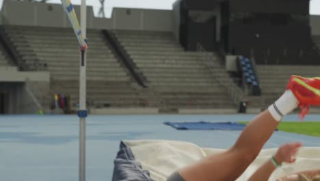 close up view of caucasian athlete doing high jump