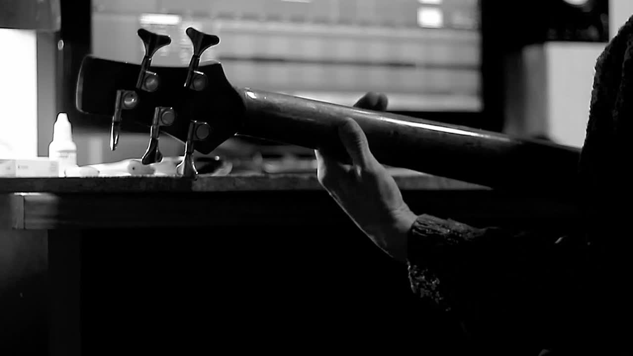 electric guitar studio lighting rock instrument detail high contrast with people stock footage stock video