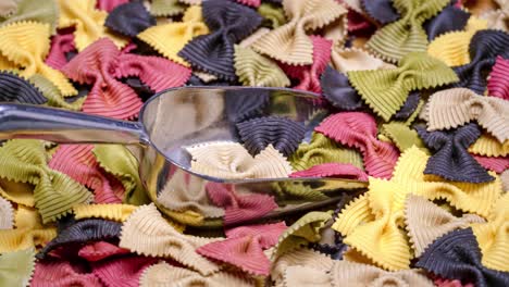 colored farfalle pasta bow tie pasta background.