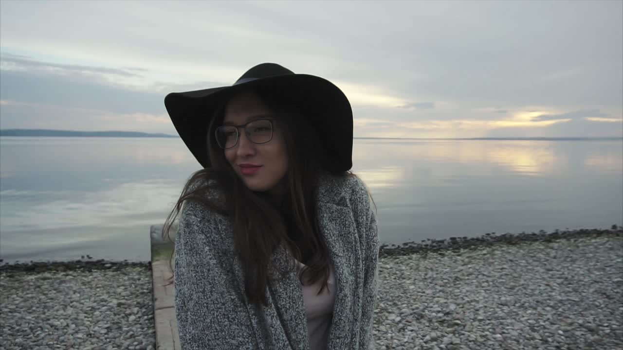 Woman by the Lakeside at Sunset