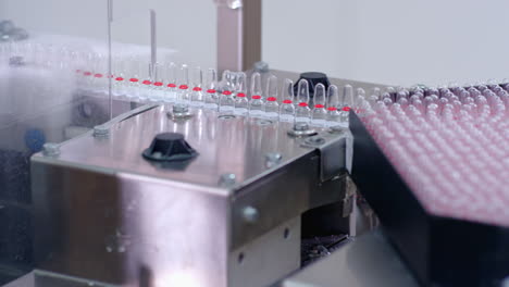 pharmaceutical manufacturing line. medical ampoules on production line