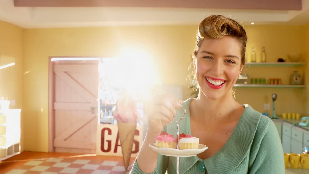 Waitress holding tray of muffins in caf&Atilde;&copy; 4k