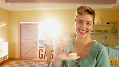 waitress holding tray of muffins in cafã© 4k