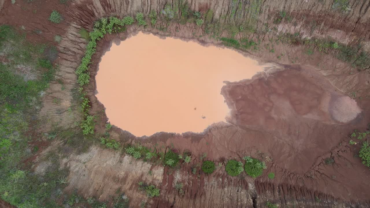 Aerial View Of Quarry Site With Muddy Water Near African Farm In Loitokitok, Kenya