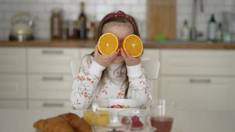 little girl eating breakfast