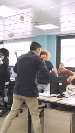 male boss throwing money to employees