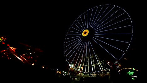 ferris wheel in amusement park at night