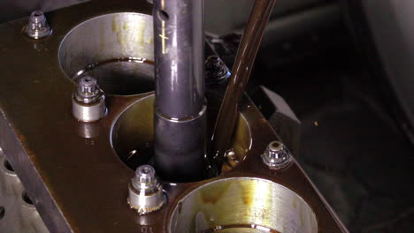 changing engine oil: close-up of oil being poured into engine