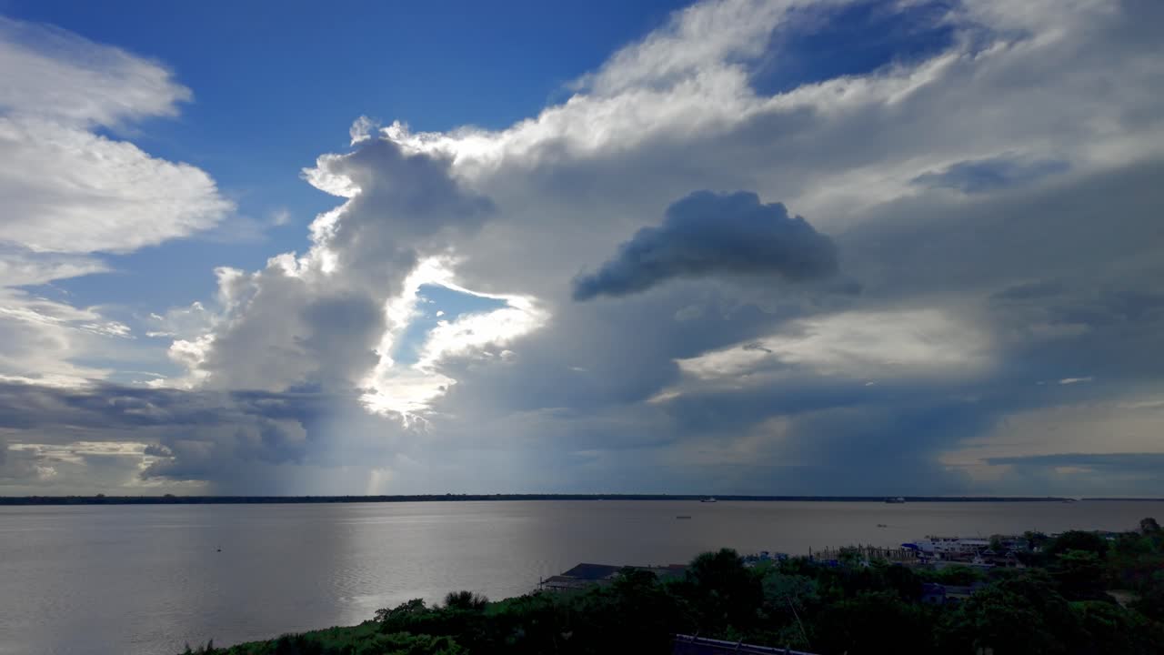 Dramatic Sky with Sunlight Over a Wide River