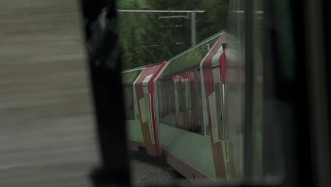 mirror reflection of train moving across countryside