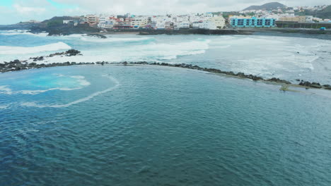 flying over the el puertillo pools in the municipality of arucas and with strong waves