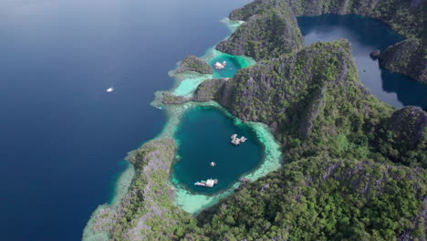 Captivating-aerial-shot-of-Twin-Lagoon,-Coron,-Palawan