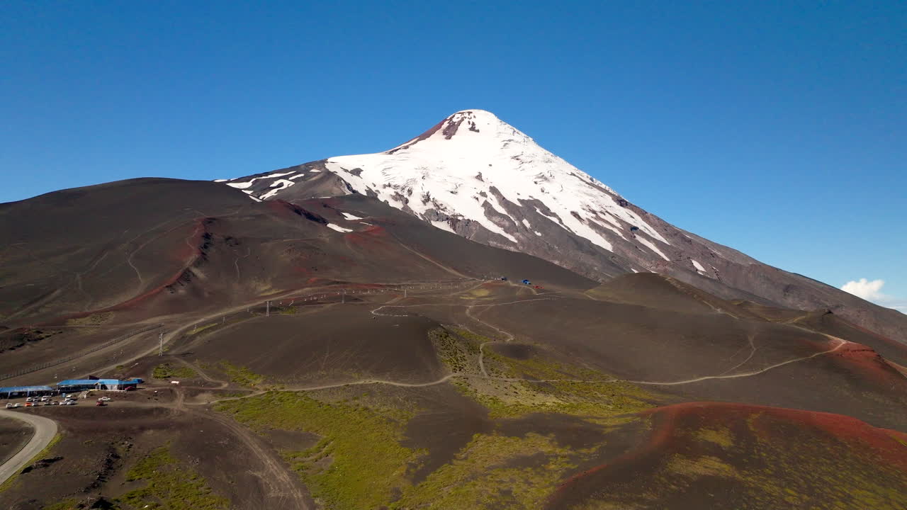 Aerial approach toward snow-capped Osorno volcano in southern Chile