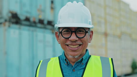 smiling engineer at a shipping container port