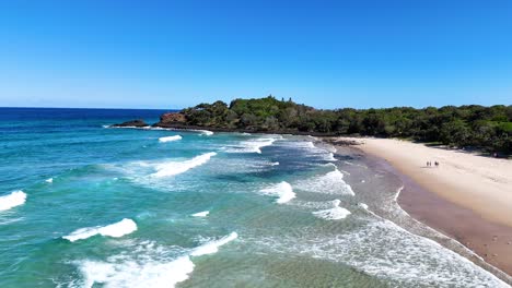coastal landscape with waves and sandy beach