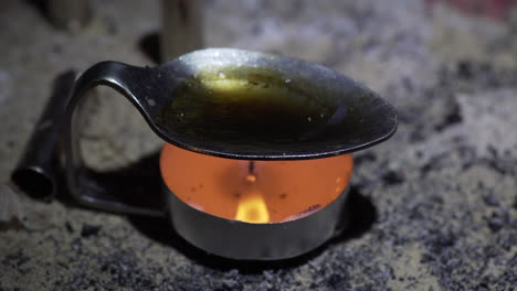 heroin cooking in spoon preparing for drug injection