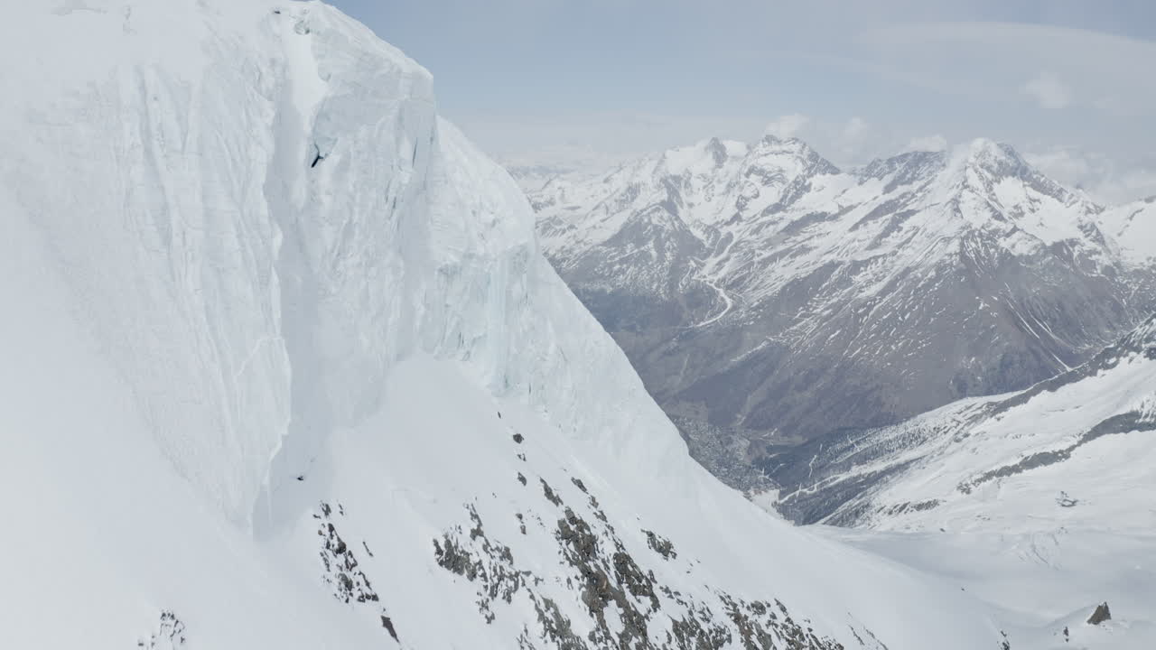 Stunning aerial footage of glaciers in Saas-Fee and Zermatt, showcasing ice formations, crevasses, seracs, and the dramatic impact of global warming on these majestic alpine landscapes.