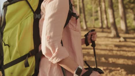 active senior woman hiking in forest