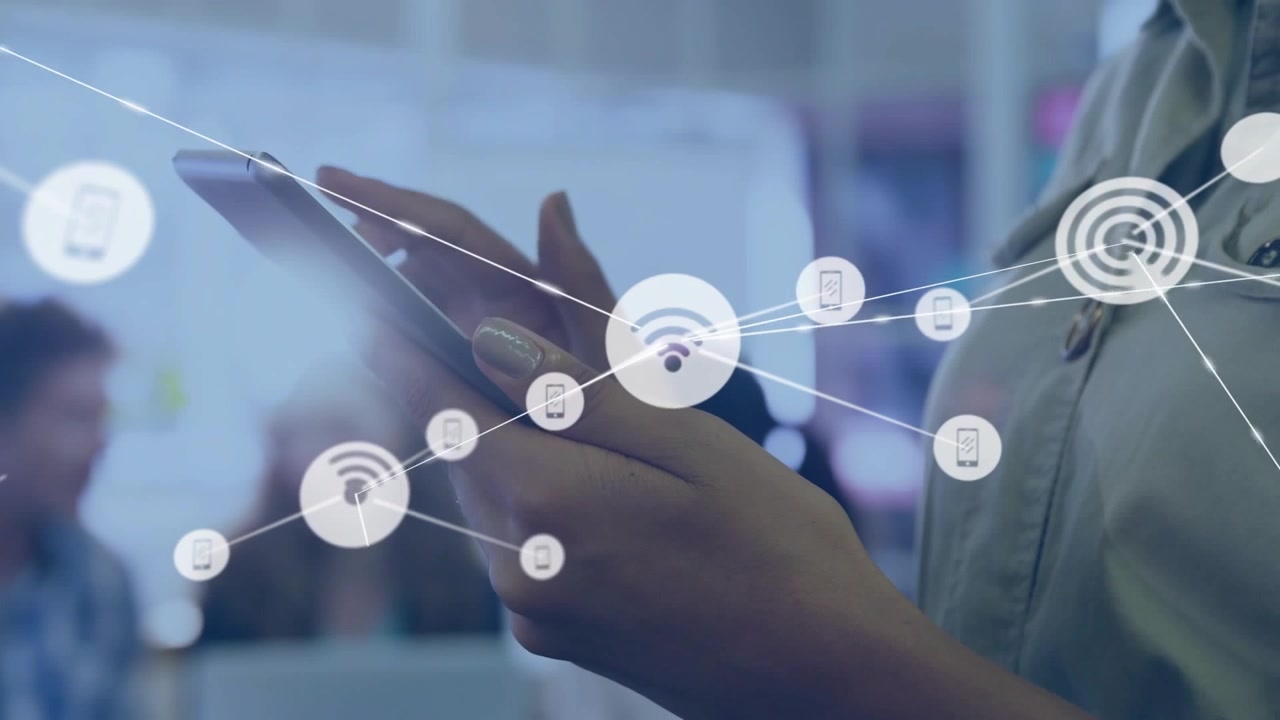 Worker tapping phone in office, forming Wi-Fi nodes linking devices for business collaboration