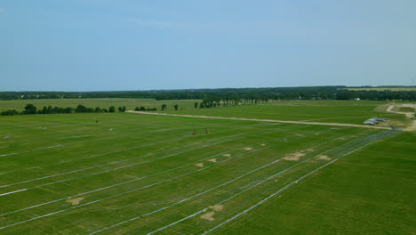 Aerial-over-biggest-area-of-solar-panels-in-Central-Europe,-renewable-green-energy-from-sun,-Poland,-Zwartowo