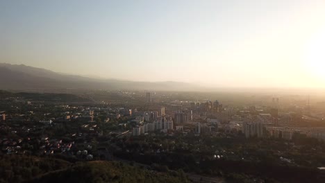 ferris wheel on the green hill kok tobe at sunset