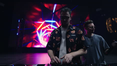 djs performing at a nightclub