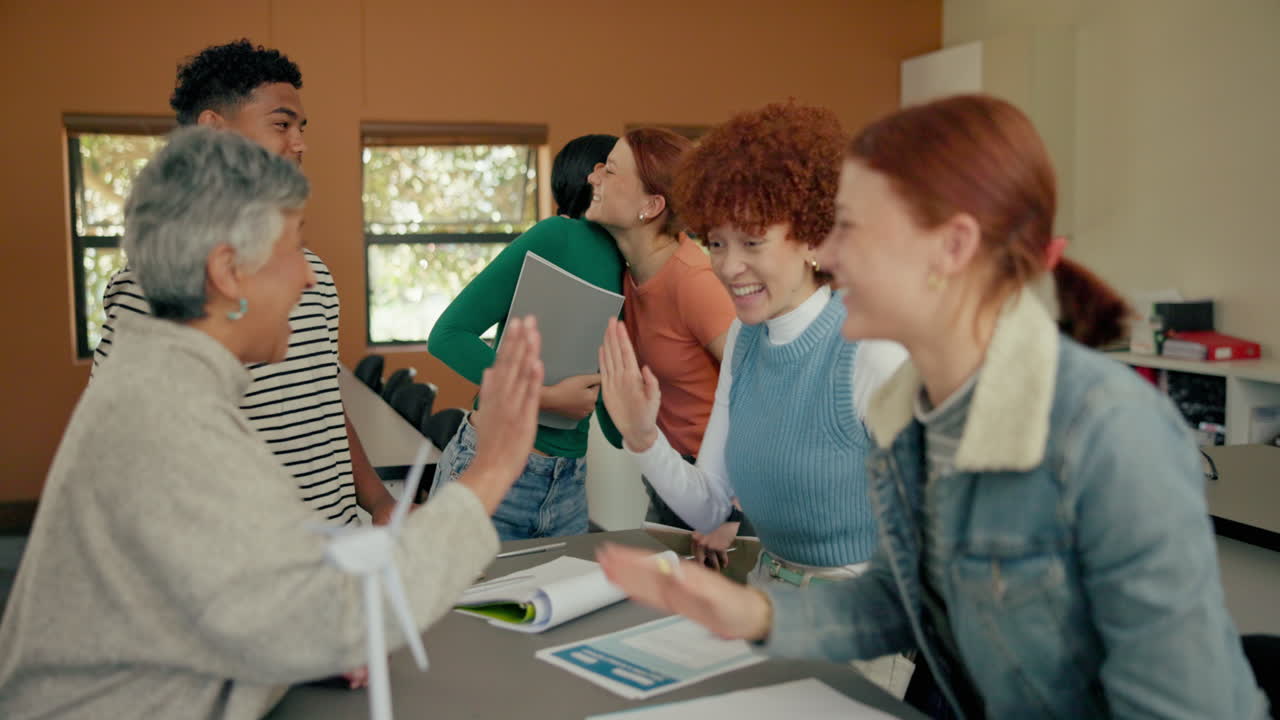 Diverse group of students celebrating success with high fives and teamwork