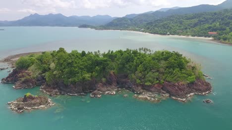 aerial view over idyllic koh chang isolated exotic paradise island heading towards turquoise ocean coastline