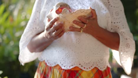 Woman-Holding-Lambi---Close-Up-Shot