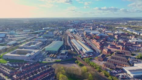 city panorama of derby, uk warehouses and businesses are stretched along the railway