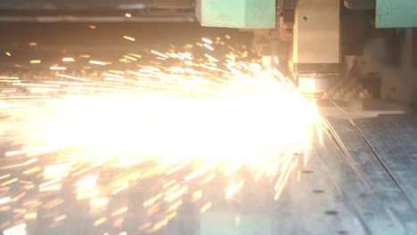 bright sparks scatter in process of laser metal cutting. process of metalworking