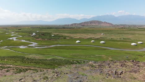 aerial flyover gorgeous green mongolian countryside with yurts and streams