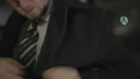 a man searches his pockets